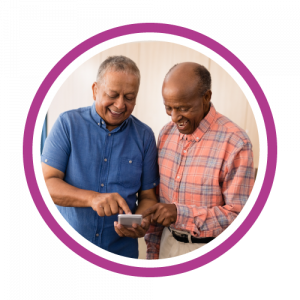 Two men are using a smart device